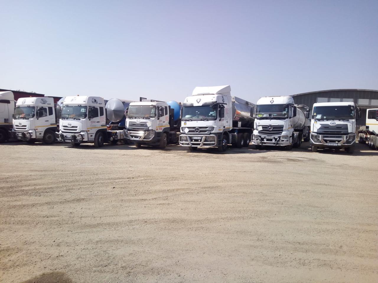 Fleet of trucks carrying freight - NickJak Logistics