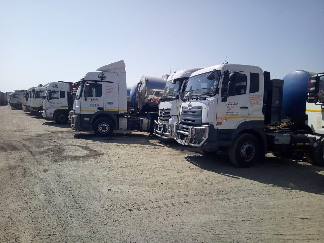 Fleet of trucks carrying freight - NickJak Logistics